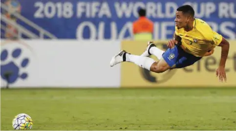  ??  ?? NATAL: Brazil’s Gabriel Jesus flies in the air as he fight for the ball during a 2018 World Cup qualifying soccer match against Bolivia, in Natal, Brazil, Thursday. — AP