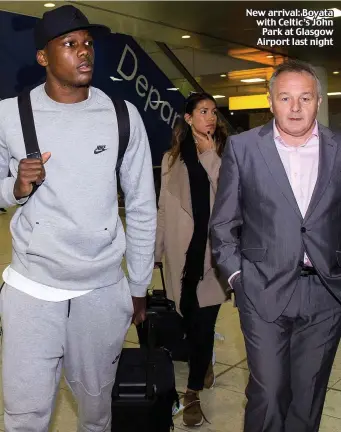  ??  ?? New arrival: Boyata with Celtic’s JohnPark at Glasgow Airport last night