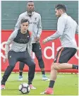  ??  ?? FOCUS: Liverpool stars Philippe Countinho and Emre Can training