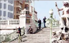  ?? STAN MARCELJA/TWITTER ?? French police stand on the stairs leading to the Saint-Charles main train station in Marseille, southern France, after an attack yesterday.