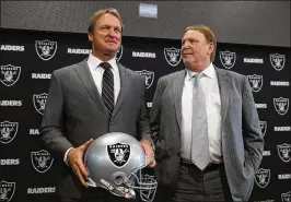  ?? GETTY IMAGES ?? Owner Mark Davis (right) said Tuesday he’s been pursuing Jon Gruden’s return as coach since taking over the Raiders after his father’s death six years ago.