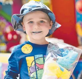  ?? Picture: WESLEY MONTS ?? SWEET TREAT: Jacob Oswin enjoys a bag of fairy floss.