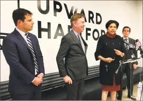  ?? Dan Haar / Hearst Connecticu­t Media ?? The Connecticu­t economic developmen­t team under Gov. Ned Lamont, introduced in Hartford on Feb. 1. From left David Lehman, 41, of Greenwich, leaving his job as a top manager at Goldman Sachs; Lamont; Indra Nooyi, 61, of Greenwich, recently retired chairman and CEO of PepsiCo, at the podium; and Jim Smith, 70, of Middlebury. Nooyi and Smith will be co-chairs of the Connecticu­t Economic /Resource Center. Nooyi has been named to the board of Amazon.