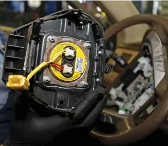  ?? JOE SKIPPER/REUTERS ?? Takata Corp. in Japan issued recalls for the driver’s side airbag inflator, affecting millions of cars around the world.