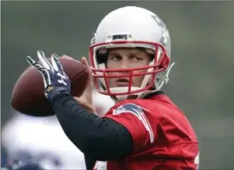  ?? ELISE AMENDOLA, THE ASSOCIATED PRESS ?? Tom Brady throws a pass during a team practice in Foxborough, Mass., on June 6.