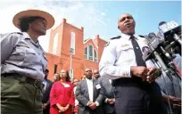  ??  ?? Atlanta Police Chief George Turner, right, speaks next to Judy Forte, superinten­dent of the M.L.K. National Historic Site, during a news conference after Confederat­e flags were found on the premises of Ebenezer Baptist Church on Thursday in Atlanta.