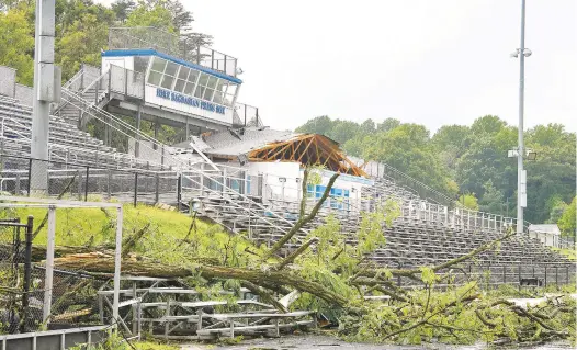  ?? PAUL W. GILLESPIE/ CAPITAL GAZETTE ?? A suspected tornado caused heavy damage to the stadium at South River High School, including tearing the roof off the concession stand. Heavy thundersto­rms and at least one tornado hit
the Annapolis and Anne Arundel County area Wednesday.