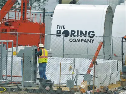  ?? SCOTT VARLEY — STAFF ARCHIVES ?? Sections of a tunnel boring machine are being worked on in a parking lot across the street from SpaceX in Southern California. Elon Musk announced a tentative agreement for The Boring Company to build an undergroun­d train from New York to Washington,...