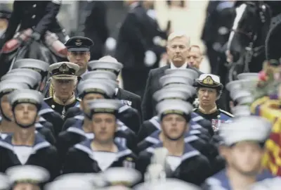  ?? ?? King Charles III and the Princess Royal follow the State Gun Carriage as it carried the coffin of Queen