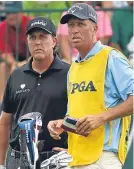  ??  ?? Phil Mickelson and Bones Mackay.