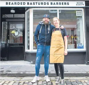  ?? Picture: Steven Brown. ?? Salon director Arlene MacGillivr­ay and Craig McKay at the shop in Bruce Street, Dunfermlin­e.