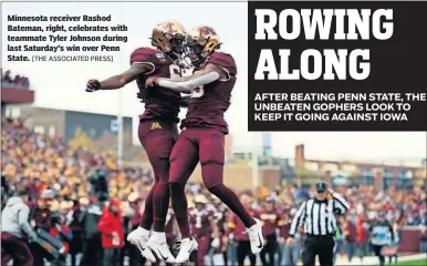  ?? [THE ASSOCIATED PRESS] ?? Minnesota receiver Rashod Bateman, right, celebrates with teammate Tyler Johnson during last Saturday’s win over Penn State.