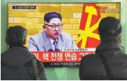  ?? Jung Yeon-Je / AFP / Getty Images ?? Travelers at a Seoul rail station watch a broadcast of a speech by North Korean leader Kim Jong Un.