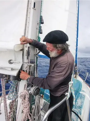  ??  ?? A dependable windvane that can handle big wind and waves is more than a convenienc­e, it’s a key piece of safety gear because it helps the crew remain rested. Tucking in a reef before things get sporty (above) is prudent seamanship.