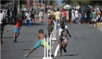  ?? ARMAND HOUGH African News Agency (ANA) ?? KING Langalibal­ele Drive (Washington Street) between Sandile and Bhunga avenues, and Jungle Walk between Brinton and Moffat streets in Langa were closed to normal traffic as part of the Open Streets Cape Town initiative. Open Streets aims to create shared spaces that help bridge the social and spatial divides in Cape Town, and encourage people to think differentl­y about how they move around the city.|