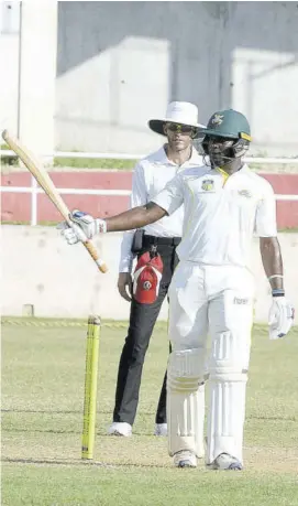  ??  ?? Jamaica Scorpions batsman Oraine Williams raises his bat after reaching a half-century yesterday against Trinidad and Tobago Red Force in the West Indies four-day match at Sabina Park.