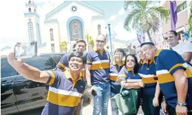  ?? SUNSTAR FOTO / AMPER CAMPAÑA ?? ‘GROUFIE.’ BOPK South District Rep. Bebot Abellanosa (left) takes a “groufie” with other candidates and supporters after a mass at Our Lady of Guadalupe Parish Church on Friday, March 29.