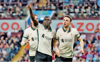  ?? ?? Liverpool’s Sadio Mane celebrates scoring their second goal with teammates