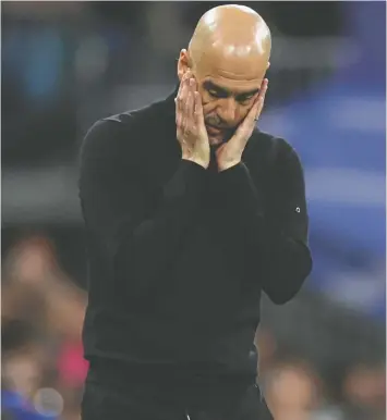  ?? CARL RECINE/ACTION IMAGES VIA REUTERS ?? Manchester City manager Pep Guardiola on the sidelines in Madrid on Wednesday as Real advanced to the Champions League final.