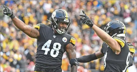  ?? Peter Diana/Post-Gazette ?? The new labor agreement will make it easier for the Steelers to free up money under the salary cap to re-sign linebacker Bud Dupree, left, by signing other players to new contracts and reducing their cap hits.