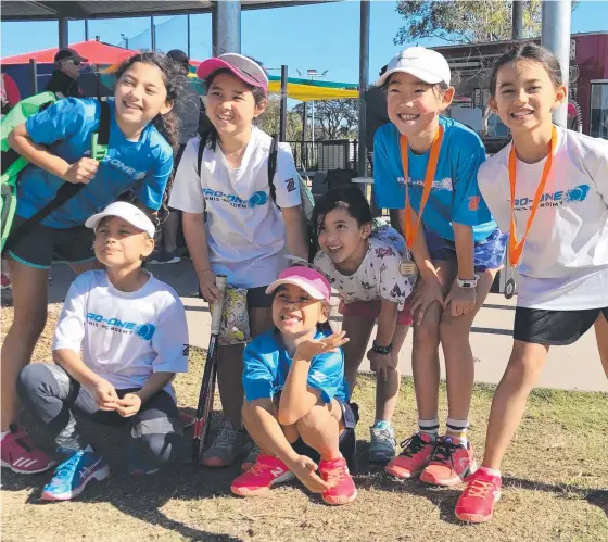  ?? Picture: SUPPLIED ?? Gold Coast juniors at the Orange Ball tournament (back, from left) Sofia Goldemberg, Cyra Abedian, young tennis fan Ivy Abedian, Jinyu Yan and Tori Russell and (front, from left) Cassandra Chatham and Kira Russell.