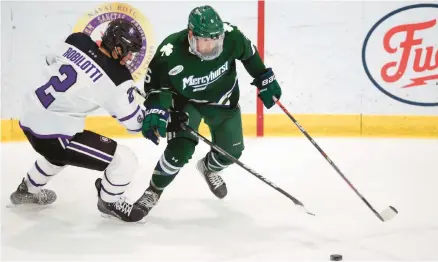  ?? STEW MILNE/AP ?? Holy Cross’s Jack Robilotti, left, defends Mercyhurst University’s Carson Briere during the first half of an NCAA hockey game on Nov. 12, 2021, in Worcester, Massachuse­tts. The son of Philadelph­ia Flyers interim general manager Danny Briere has apologized after a video posted on social media showed him pushing an empty wheelchair down a set of stairs. Carson Briere issued his apology in a statement released by the NHL’s Flyers on Wednesday.