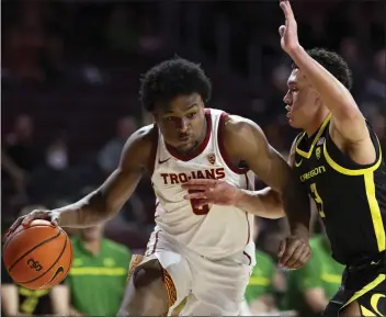  ?? KYUSUNG GONG — THE ASSOCIATED PRESS ?? USC guard Bronny James drives to the basket against Oregon guard Jackson Shelstad during Thursday night's game.
