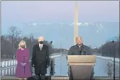  ?? ALEX BRANDON — THE ASSOCIATED PRESS FILE ?? Then-President-elect Joe Biden and his wife, Jill, listen as Cardinal Wilton Gregory, archbishop of Washington, delivers the invocation during a COVID-19 memorial at the Lincoln Memorial Reflecting Pool in Washington. Gregory has made clear that President Biden, who sometimes worships in Washington, is welcome to receive Communion at the archdioces­e’s churches.