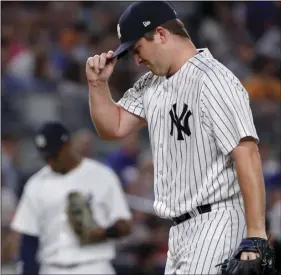  ??  ?? New York Yankees relief pitcher Adam Warren reacts after walking New York Mets’ Jose Bautista during the fifth inning a baseball game July 20, in New York. AP PHOTO/JULIE JACOBSON