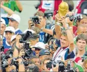  ?? GETTY IMAGES ?? France coach Aime Jacquet lifts the World Cup after the hosts stunned Brazil 30 in the final on July 12, 1998.