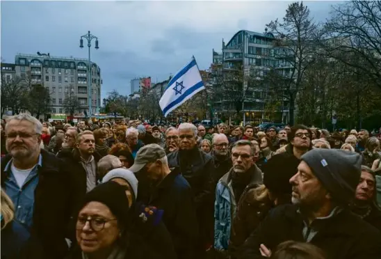  ?? MARKUS SCHREIBER/ASSOCIATED PRESS ?? People gathered for a march against antisemiti­sm in central Berlin on Thursday, the 85 anniverary of Kristallna­cht.