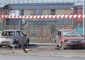  ?? ?? Damaged cars are seen in front of a kindergart­en following fresh aerial attacks in Belgorod, Russia, on Wednesday.