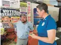  ?? KENNETH K. LAM/BALTIMORE SUN ?? Heather Mizeur, right, the Democratic Party challenger to incumbent Republican U.S. Rep. Andy Harris, talks July 28 with Claiborne Stubbs, Cecil County Republican Central Committee member, at the county fair.