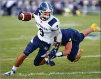  ?? DAVID C. TURBEN — FOR THE NEWS-HERALD ?? West G wide receiver Torry Stazzone catches a pass and turns upfield chased by Kirtland linebacker Philip LaVerde on Sept. 10.