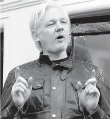  ?? FRANK AUGSTEIN, THE ASSOCIATED PRESS ?? WikiLeaks founder Julian Assange speaks outside the Ecuadorian embassy in London on Friday.