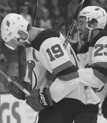  ?? The Associated Press ?? New Jersey Devils forward Travis Zajac, left, and teammate forward Stefan Noesen celebrate Zajac’s goal against the Columbus Blue Jackets during the first period in Columbus, Ohio on Tuesday.