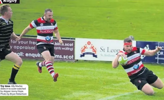  ??  ?? Try time Ally Mackie slides in to score watched by skipper Jonny Hope. Photo by Bryan Robertson