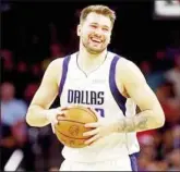  ?? ?? May 15, 2022; Phoenix, Arizona, USA; Dallas Mavericks guard Luka Doncic (77) reacts during the fourth quarter against the Phoenix Suns in game seven of the second round for the 2022 NBA playoffs at Footprint Center. Mandatory Credit: Mark J. RebilasUSA TODAY Sports