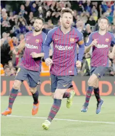  ??  ?? Barcelona’s Lionel Messi celebrates scoring their second goal from the penalty spot. — Reuters photo