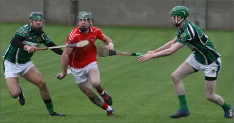  ??  ?? Eddie Power goes for a gap in the Erin’s Isle defence during Saturday’s semi-final success in O’Toole Park, Crumlin.