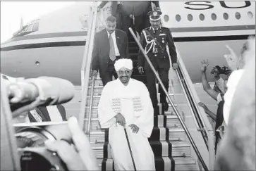  ?? Ebrahim Hamid
AFP/Getty Images ?? PRESIDENT Omar Hassan Ahmed Bashir arrives in Khartoum, the Sudanese capital, from Johannesbu­rg. South Africa’s High Court had issued an order barring his departure and a warrant for his arrest.