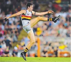  ?? Picture: MICHAEL FRANCHI ?? Adelaide’s Mitch McGovern boots one during the second quarter