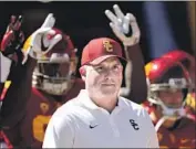  ?? Jae C. Hong Associated Press By J. Brady McCollough ?? CLAY HELTON has records of 10-3 and 11-3 in his two seasons as USC’s head football coach.