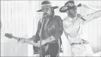  ??  ?? After what was an impressive year with their song “Old Town Road,” Lil Nas X and Billy Ray Cyrus took to the 2020 Grammy stage to perform their hit song.