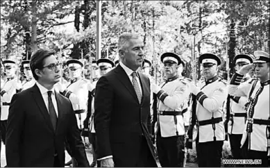  ??  ?? President of North Macedonia Stevo Pendarovsk­i(L) and visiting President of Montenegro Milo Djukanovic review the honor guards in Skopje, North Macedonia, Oct. 2, 2019. (Photo: Xinhua)