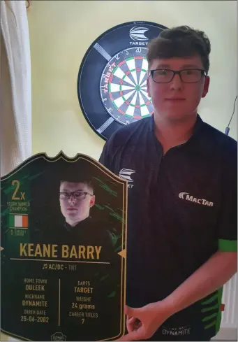  ??  ?? Keane with his Ultimate Darts card.