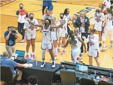  ?? MICHAEL THOMAS/AP ?? Arizona guard Shaina Pellington (1) celebrates Arizona's win over BYU in the second round of the NCAA Tournament at the UTSA Convocatio­n Center in San Antonio on Wednesday. The Wildcats advance to
the Sweet 16 to face Texas A&M.