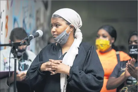  ?? BROOKE HERBERT — THE OREGONIAN VIA AP ?? Teressa Raiford, executive director of Don’t Shoot Portland, speaks in front of a crowd gathered in front of the Mark O. Hatfield Federal Courthouse in downtown Portland, Ore., on July 17, 2020.