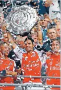  ?? Photo: REUTERS ?? Silverware: Arsenal’s Mikel Arteta lifts the Community Shield after a 3-0 victory over Manchester City.