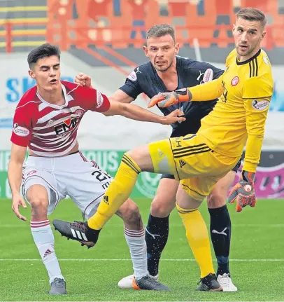  ?? Pictures: SNS Group. ?? Above left: Andy Boyle watches as his header beats Hamilton keeper Gary Woods to open the scoring; above right, Kharl Madianga fires in the clinching second goal in injury time, and left, Dundee boss Neil Mccann celebrates with scorer Madianga at the final whistle.